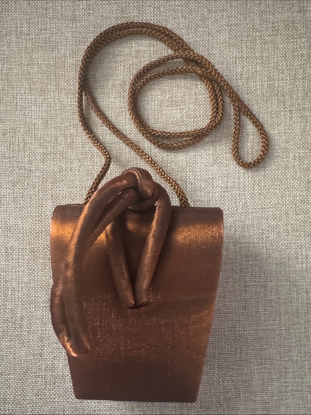 La Regate Copper Metallic Knot Crossbody Bag with Chain Strap